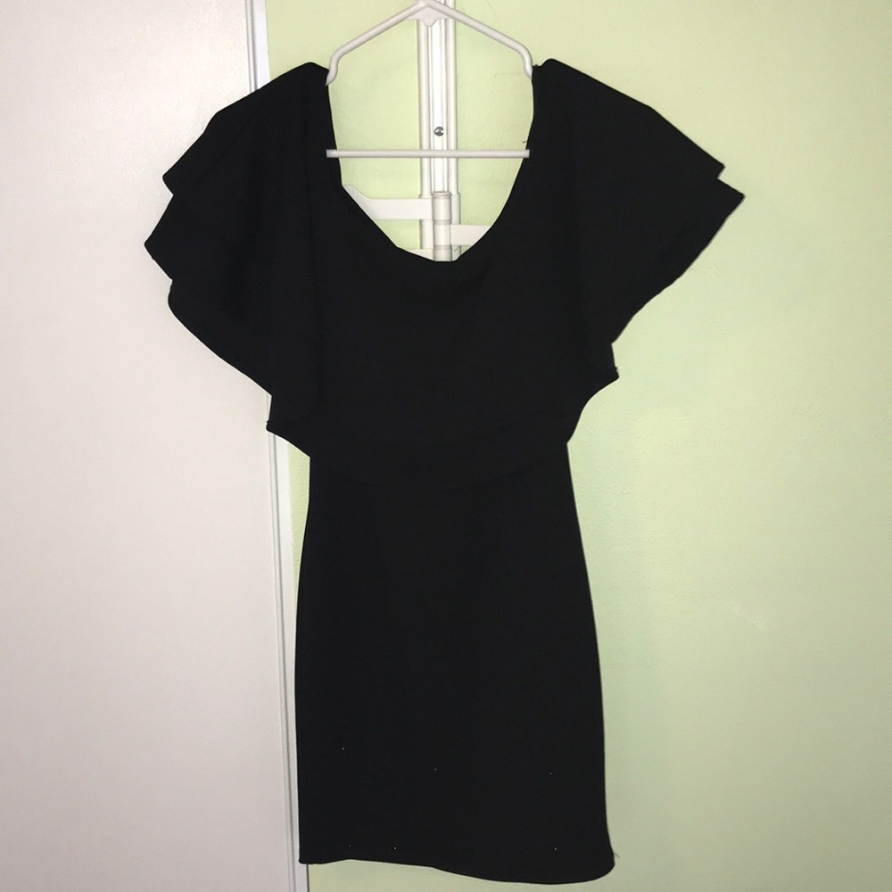 Black off the shoulder black fitted dress.